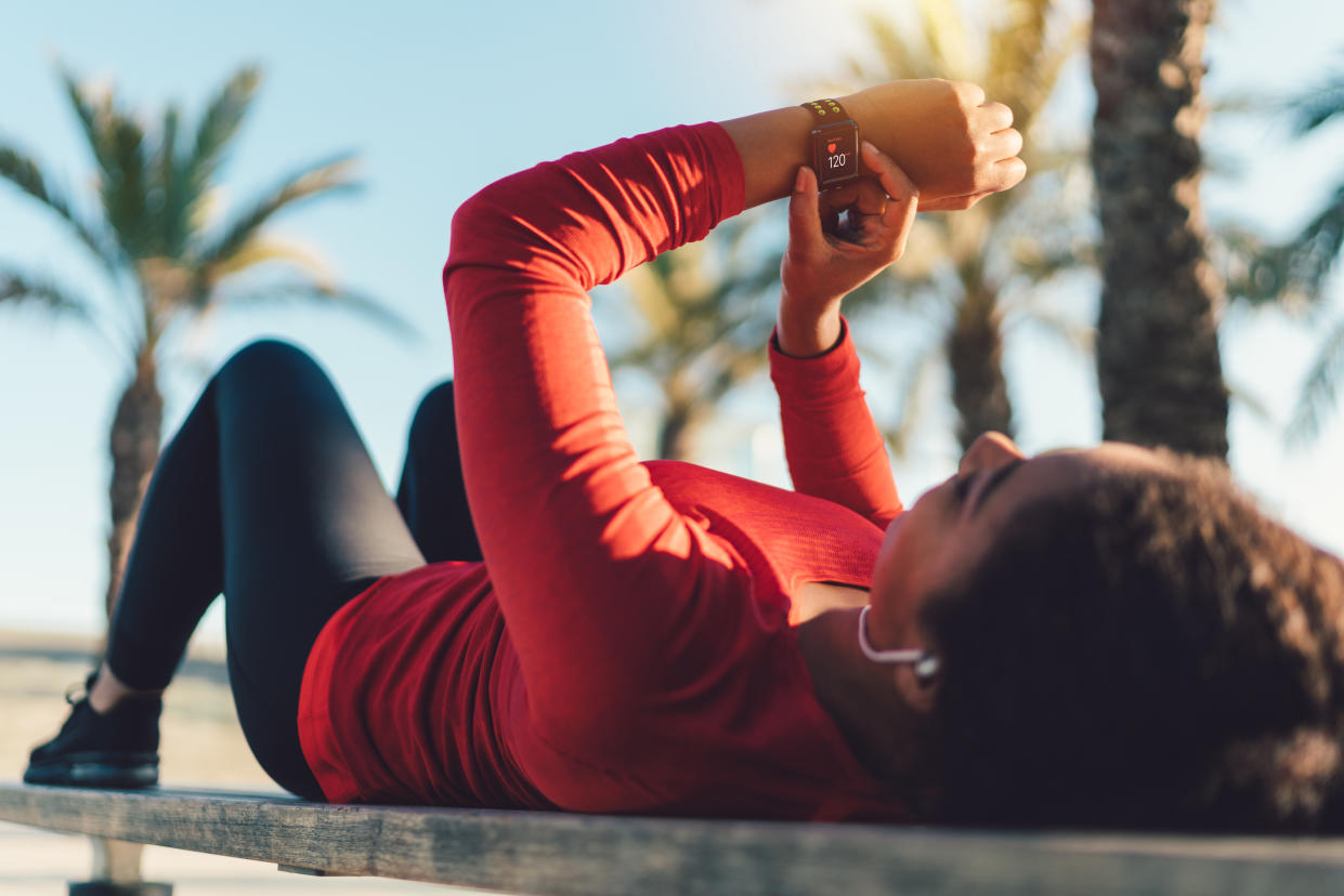 woman-checking-heart-rate-variability-fitness-tracker