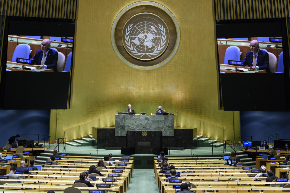 In this UN Photo, Craig John Hawke, Permanent Representative of New Zealand to the United Nations, is shown on video monitors as he speaks in person, during the 75th session of the United Nations General Assembly, Tuesday, Sept. 29, 2020, at U.N. headquarters. (Loey Felipe/UN Photo via AP)