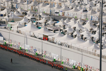 Police officers walk in formation to be deployed around muslim pilgrims' tents in Mina ahead of annual Haj pilgrimage near the holy city of Mecca, Saudi Arabia August 19, 2018. REUTERS/Zohra Bensemra??