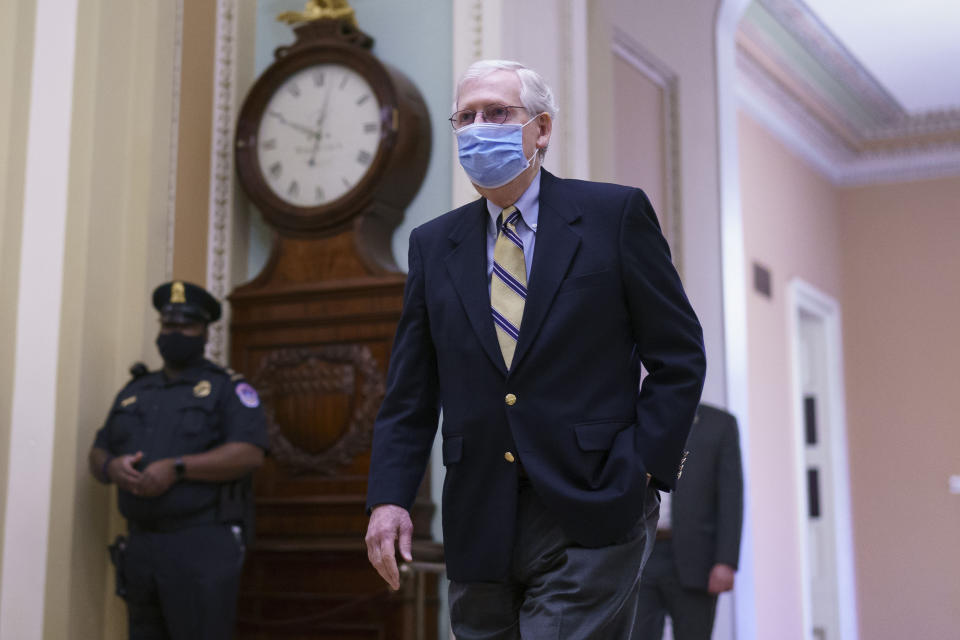 Senate Minority Leader Mitch McConnell, R-Ky., arrives as the Senate convenes in a rare weekend session for final arguments in the second impeachment trial of former President Donald Trump, at the Capitol in Washington, Saturday, Feb. 13, 2021. (AP Photo/J. Scott Applewhite)