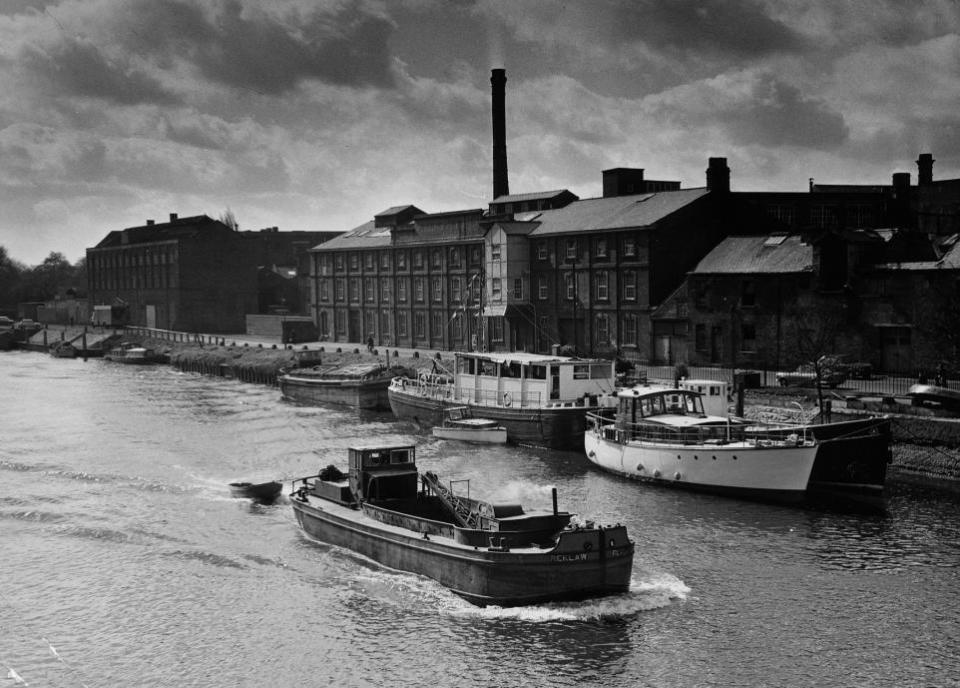 York Press: 1972 - The dredger Reklaw sails up the river Ouse past boats moored at Queen's Staith.