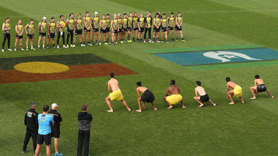 The Aboriginal flag, pictured here painted on the ground for an AFL game in 2016.