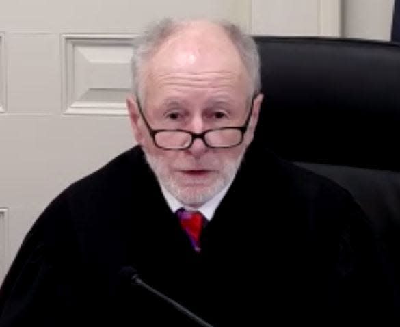 Judge Richard Mulhern heads the arraignment of Andrew Huber Young May 24, 2022.