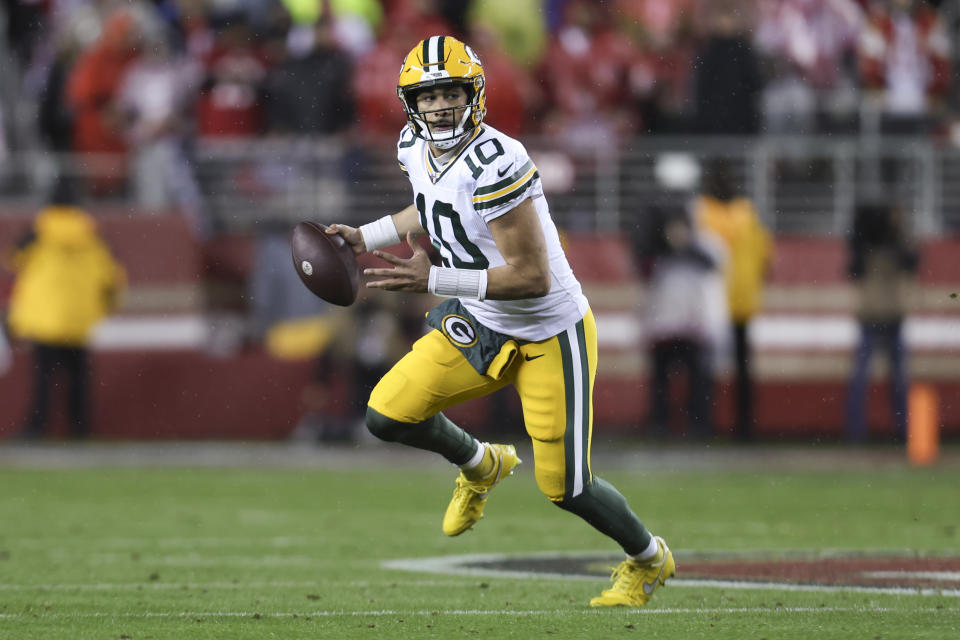 Green Bay Packers quarterback Jordan Love (10) rolls out during the first half of an NFL football NFC divisional playoff game against the San Francisco 49ers, Saturday, Jan. 20, 2024, in Santa Clara, Calif. (AP Photo/Jed Jacobsohn)