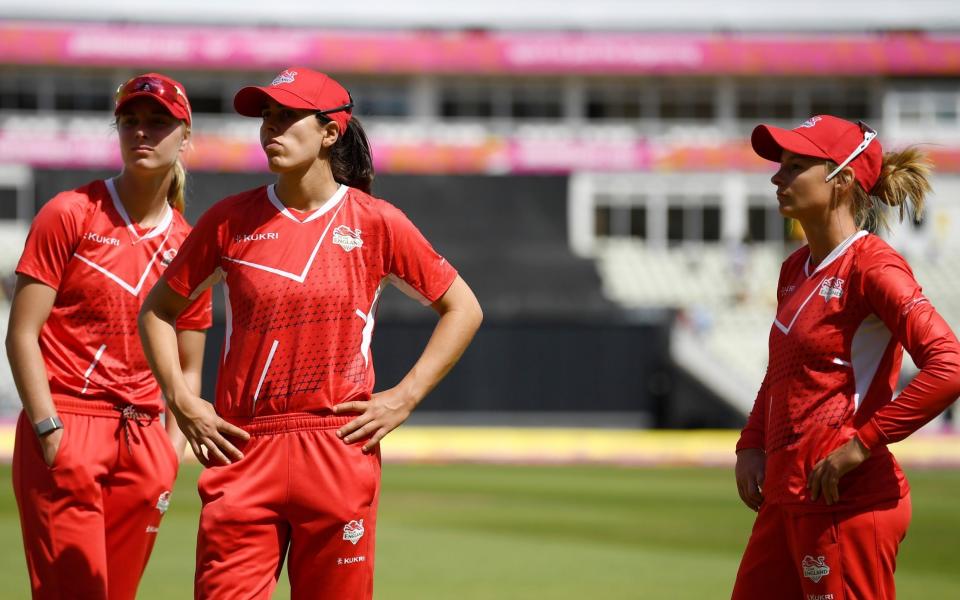 Maia Bouchier, Danni Wyatt and Freya Kemp of Team England look dejected following defeat in the Cricket T20 - Bronze Medal match between Team England and Team New Zealand on day ten of the Birmingham 2022 - GETTY IMAGES