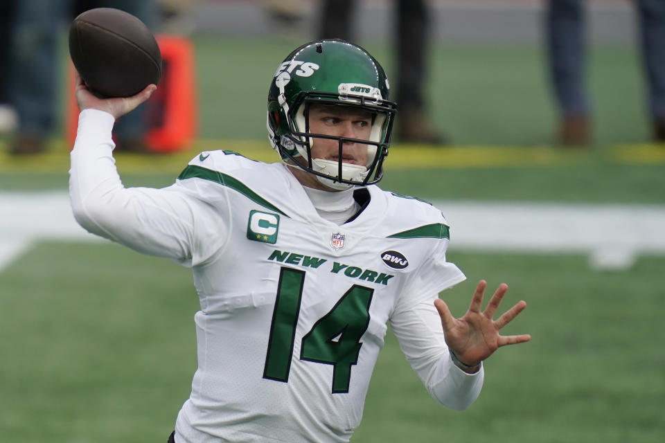 New York Jets quarterback Sam Darnold rolls out to pass against the New England Patriots in the first half of an NFL football game, Sunday, Jan. 3, 2021, in Foxborough, Mass. (AP Photo/Charles Krupa)