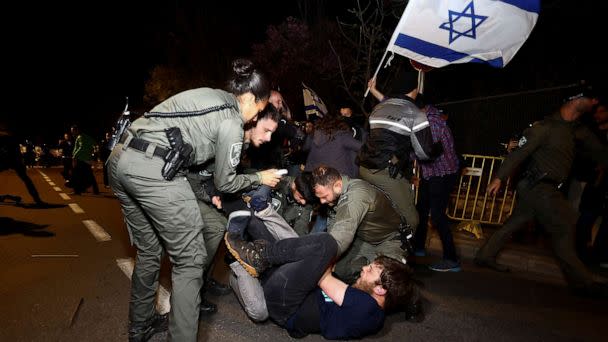 PHOTO: Police officers detain a protester during a demonstration after Israeli Prime Minister Benjamin Netanyahu dismissed the defense minister, in Jerusalem, March 26, 2023. (Ronen Zvulun/Reuters)