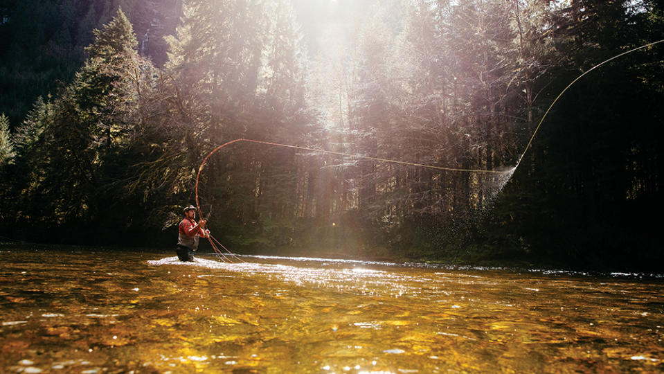 Fraser Murray casts a line in a river near the resort. - Credit: Jeremy Kopeks