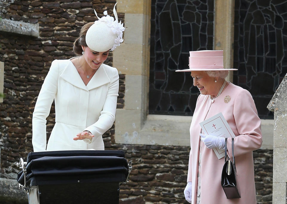 <p>The Queen chats to Catherine, Duchess of Cambridge after the christening of Princess Charlotte of Cambridge at St Mary Magdalene Church in Sandringham, England, on 5 July 2015. (AFP via Getty Images)</p> 