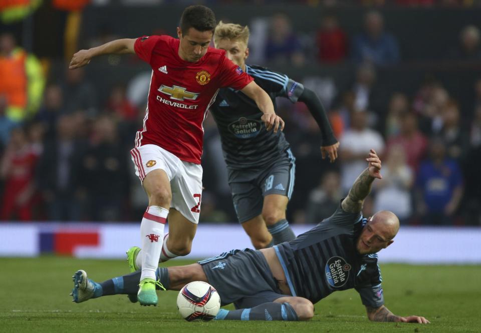 <p>Manchester United’s Ander Herrera, left takes the ball past Celta’s John Guidetti </p>