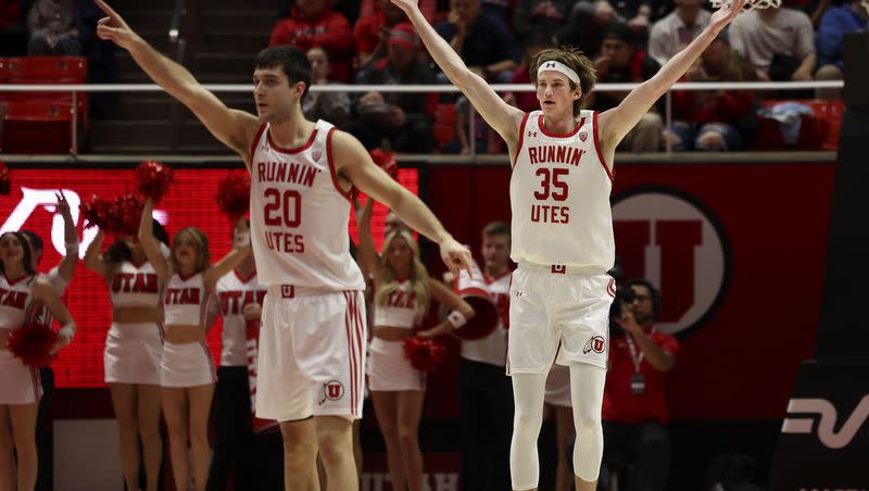 Utah Utes center Branden Carlson (35) and Lazar Stefanovic celebrate after Carlson made a 3-pointer against Washington State at the Huntsman Center in Salt Lake City on Thursday, Jan. 19, 2023. Carlson recently declared for the NBA draft.