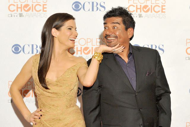 <p>Jon Kopaloff/FilmMagic</p> Sandra Bullock and George Lopez pose at the People's Choice Awards held at the Nokia Theatre L.A. Live on January 6, 2010 in Los Angeles, California.