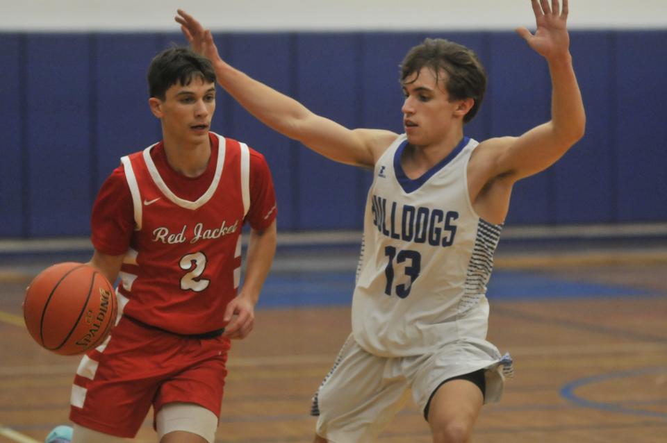 Red Jacket's James Sibeto (2) drives against the defense of Honeoye's Owen Reynolds during Thursday's game.