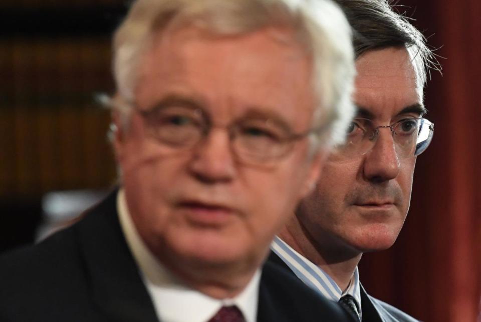 David Davis sat next to Jacob Rees-Mogg at the think tank event in London on Monday (Neil Hall/EPA)