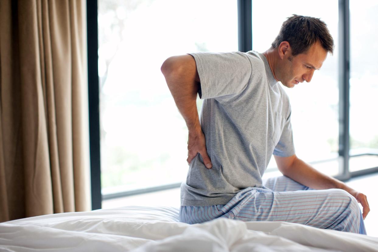 man sitting on back with back pain