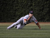 CHICAGO, IL - JUNE 16: Daniel Nava #66 of the Boston Red Sox makes a diving catch in the eighth inning against the Chicago Cubs on June 16, 2012 at Wrigley Field in Chicago, Illinois. (Photo by David Banks/Getty Images)