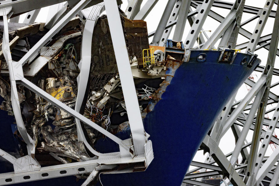 Wreckage of the Francis Scott Key Bridge rests on the container ship Dali, Wednesday, April 3, 2024, in Baltimore. (AP Photo/Julia Nikhinson)