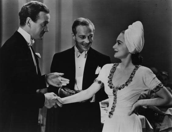 Olivia de Havilland with David Niven, left, and Douglas Walton in the 1939 film Raffles (Getty)