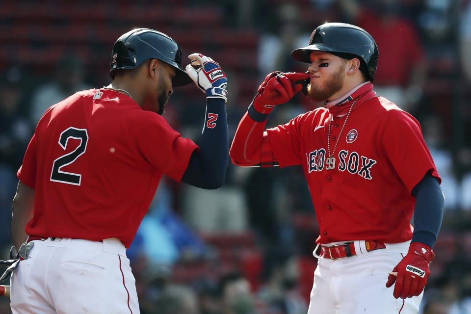 Boston Red Sox's Alex Verdugo celebrates his solo home run with Xander Bogaerts (2) during the first inning of a baseball game against the Los Angeles Angels, Saturday, May 15, 2021, in Boston. (AP Photo/Michael Dwyer)