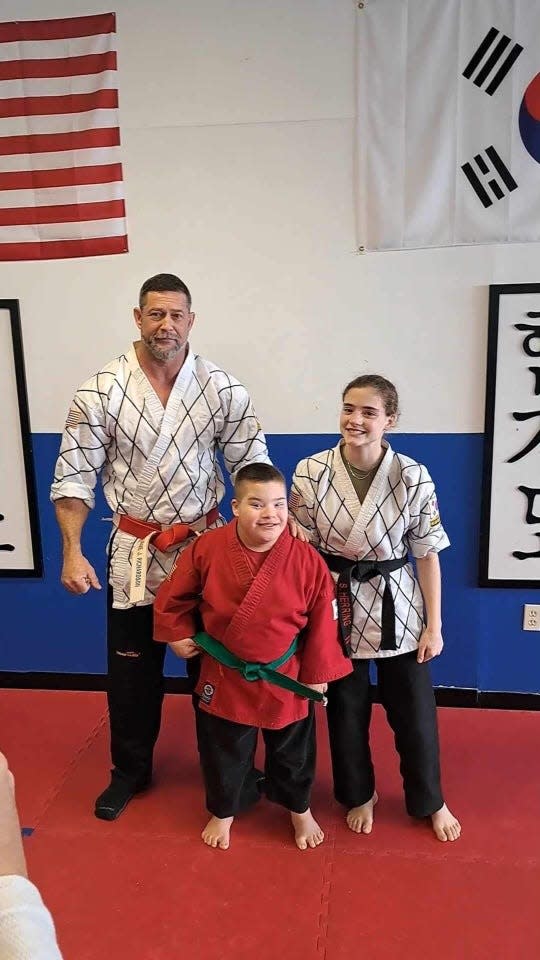 From left are Burnie Richardson, owner of Coastal Martial Arts Academy in Wilmington, Manny Rico, and Savannah Herring, lead instructor at Coastal Martial Arts Academy.