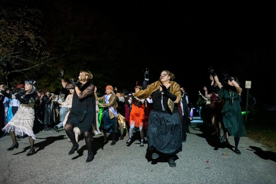 The Portsmouth Thriller dance group practices their performance before marching in the 26th annual Portsmouth Halloween Parade on Sunday, Oct. 31, 2021.