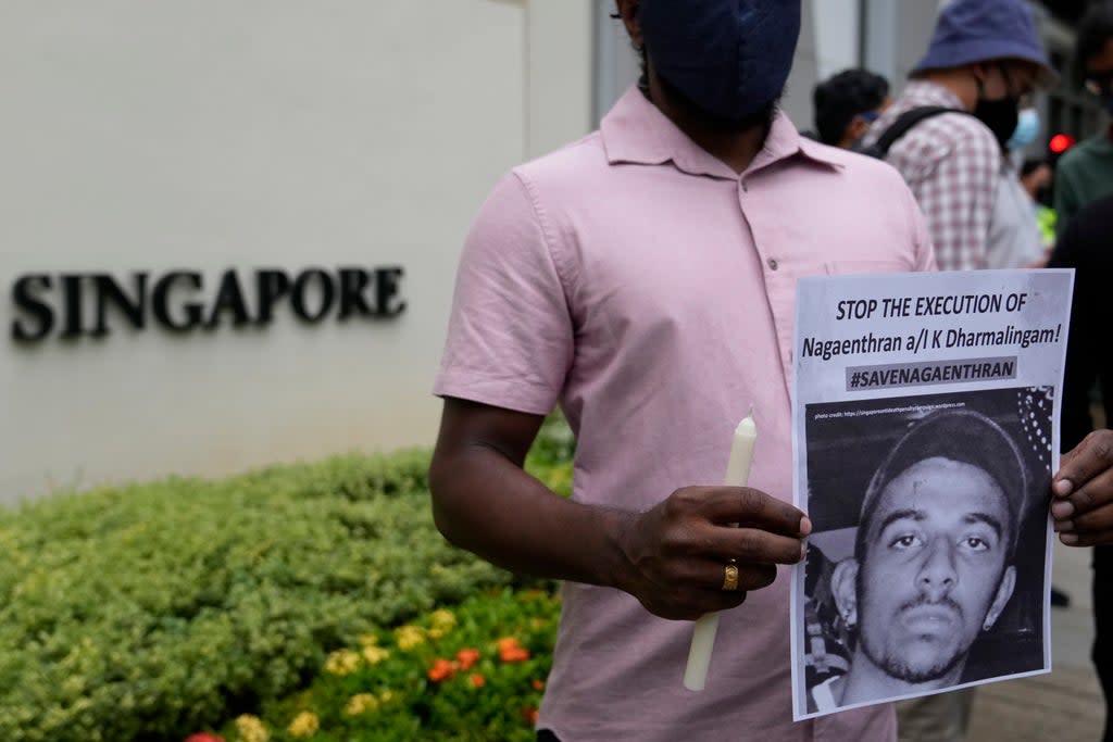 File photo: Activists attend a candlelight vigil against the execution of Nagaenthran  Dharmalingam in Kuala Lumpur, Malaysia, on 8 November 2021 (AP)