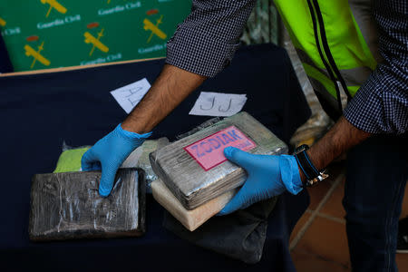 Police display a portion of the more than six tonnes of cocaine hidden among bunches of bananas which officials siezed at an industrial estate at the police headquarters in Malaga, Spain, October 25, 2018. REUTERS/Jon Nazca