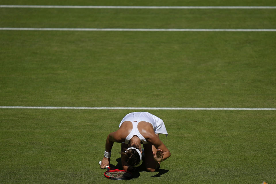 Germany's Tatjana Maria reacts after losing a point to Tunisia's Ons Jabeur in a women's singles semifinal match on day eleven of the Wimbledon tennis championships in London, Thursday, July 7, 2022. (AP Photo/Alastair Grant)