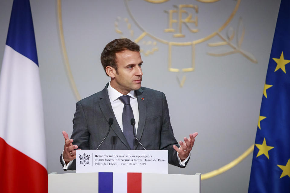 French president Emmanuel Macron delivers a speech to Paris Firefighters’ Brigade and security forces who took part in extinguishing the blaze at Notre Dame Cathedral (Christophe Petit Tesson/AP)