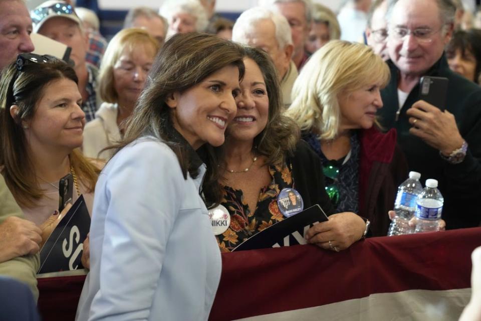 GOP presidential hopeful Nikki Haley takes selfies with supporters after a campaign event on Monday, Nov. 27, 2023, in Bluffton, S.C. Haley is among a cluster of Republican candidates competing for second place in a GOP Republican primary thus far largely dominated by former President Donald Trump. (AP Photo/Meg Kinnard) ORG XMIT: SCMK112