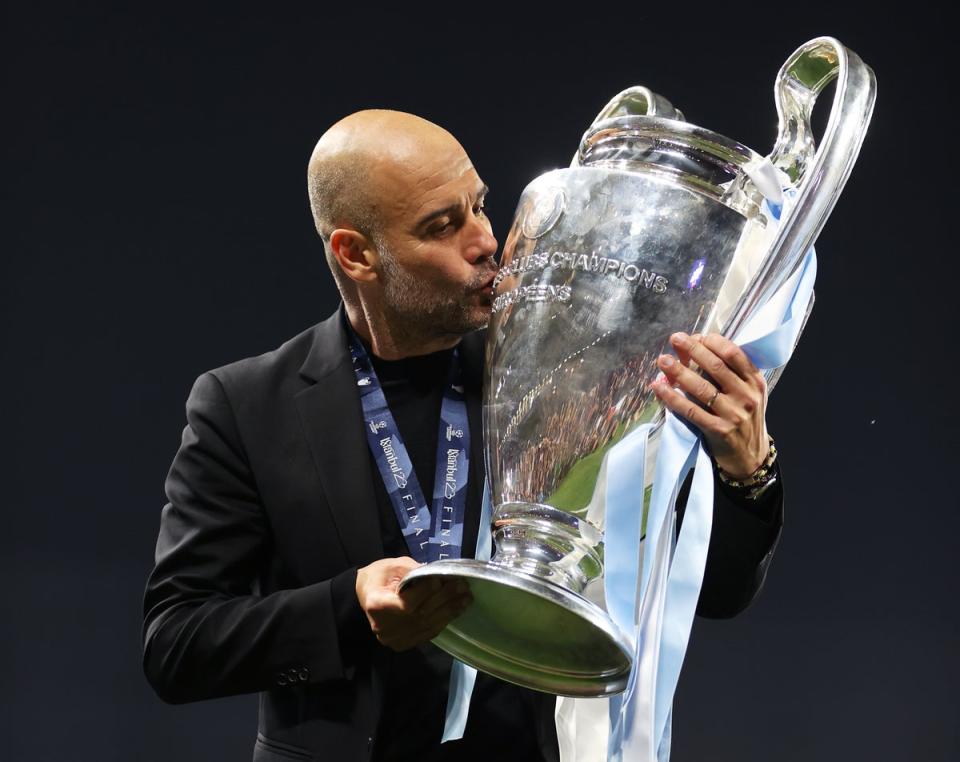 Pep Guardiola celebrates with the Champions League trophy (Getty Images)