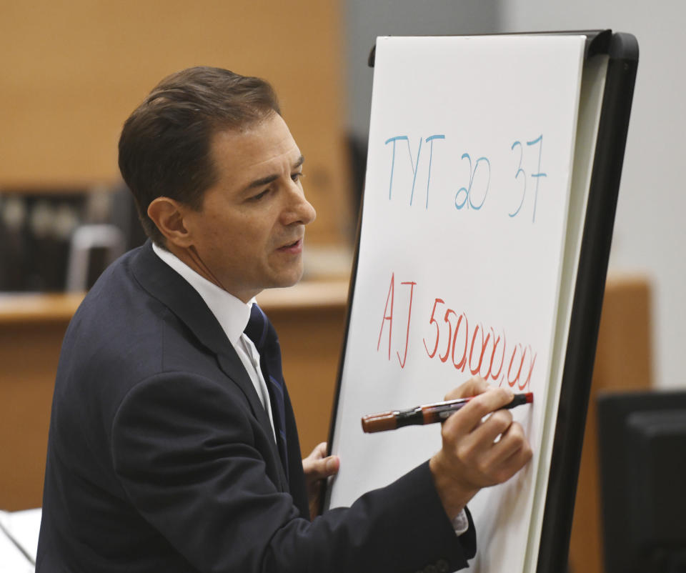 Plaintiff's attorney Chris Mattei compares the social media reach of a tweet, which Alex Jones sued for defamation in 2019, to the reach of Infowars during his testimony at the Sandy Hook defamation damages trial at Connecticut Superior Court in Waterbury, Conn. Thursday, Sept. 22, 2022. Jones was found liable last year by default for damages to plaintiffs without a trial, as punishment for what the judge called his repeated failures to turn over documents to their lawyers. The six-member jury is now deciding how much Jones and Free Speech Systems, Infowars’ parent company, should pay the families for defaming them and intentionally inflicting emotional distress. (Tyler Sizemore/Hearst Connecticut Media via AP, Pool)