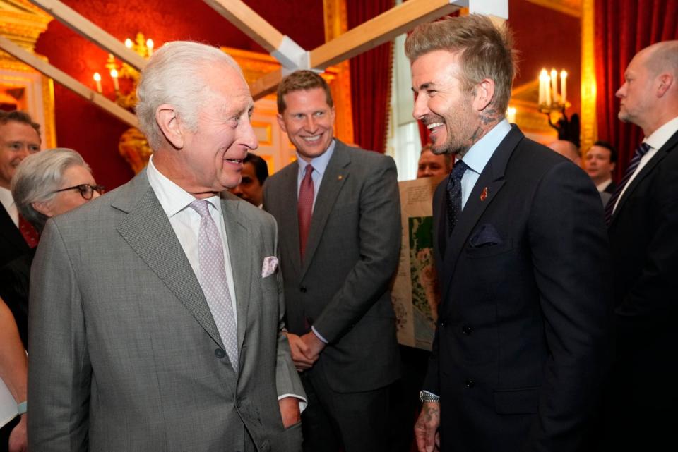 King Charles III laughs with former England footballer David Beckham (Getty Images)