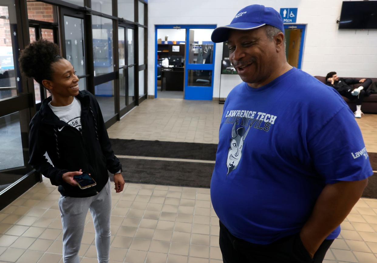 Kendall Fisher, left, and Blaine Denning Jr. have a laugh inside the Don Ridler Field House on Wednesday, Feb. 21, 2024. Fisher was the 2019 Blaine Denning Sr. Men's and Women's Basketball Scholarship Award and met up with him before he attended a basketball game and to honor his father who is in the Lawrence Technological University Athletic Hall of Fame.