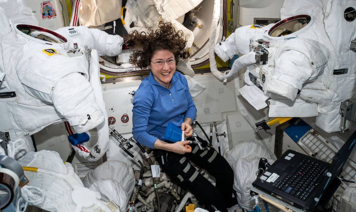 Expedition 60 Flight Engineer Christina Koch of NASA works inside the Quest joint airlock cleaning U.S. spacesuit cooling loops and replacing spacesuit components. Christina Koch/NASA