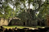 Tree roots have thrust their way into the structure of the Ta Prohm temple.