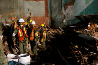 <p>Mexican soldiers gesture to ask for silence as they search for survivors in a collapsed building after an earthquake at Condesa neighborhood in Mexico City, Mexico, September 21, 2017. REUTERS/Carlos Jasso </p>