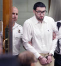 Emanuel Lopes is escorted into court on day one of his trial for the 2018 murder of Weymouth Police Sgt. Michael Chesna and Vera Adams, in Norfolk Superior Court in Dedham, Mass., Thursday June 8, 2023. (Greg Derr/The Patriot Ledger via AP, Pool)