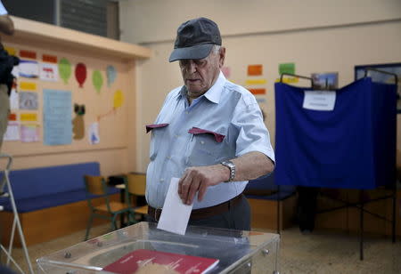 A man casts his ballot in a general election at a polling station in Athens, Greece, September 20, 2015. REUTERS/Alkis Konstantinidis