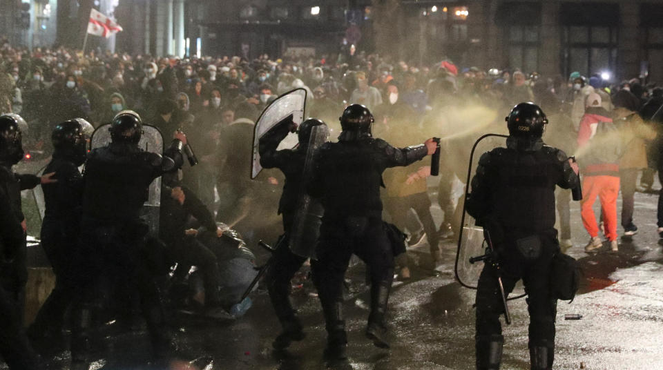 Police use tear gas to disperse protesters gathered in the streets of Tbilisi, Georgia.