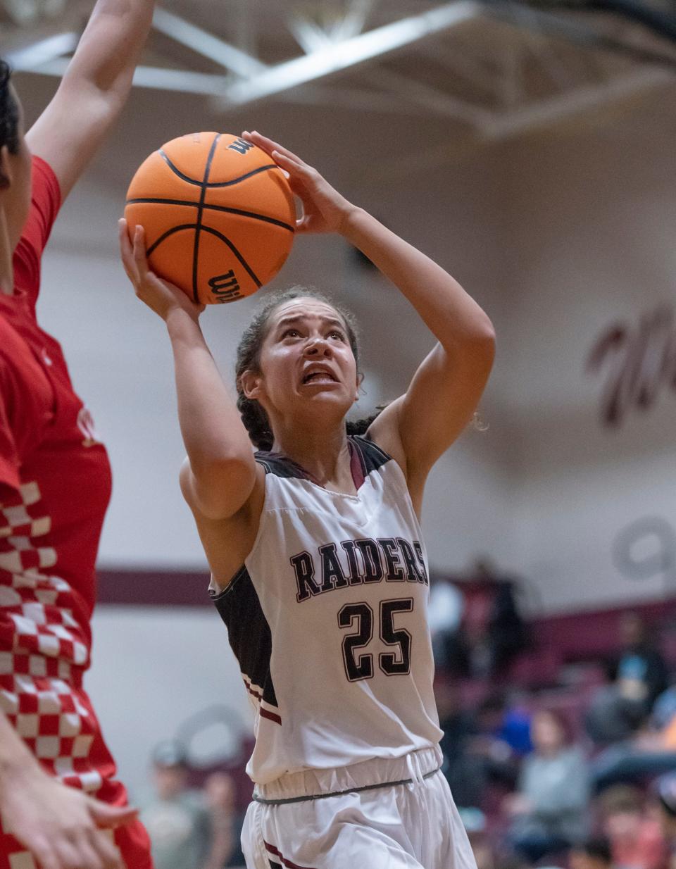 Jayah Jones (25) shoots during the Crestview vs Navarre girls basketball game at Navarre High School in Navarre on Thursday, Dec. 16, 2021.