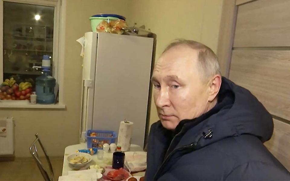 This handout video grab released by Russian Presidential Press Office on March 19, 2023, shows Russian President Vladimir Putin visiting a flat at a newly built neighborhood during his visit to Mariupol in Russian-controlled Donetsk region. - Russian President Vladimir Putin made a surprise trip to Mariupol, the Kremlin said, his first visit to territory captured from Ukraine since the start of Moscow's offensive. Just hours after Putin visited Crimea to mark the ninth anniversary of the peninsula's annexation, video distributed by the Kremlin showed him landing by helicopter in Mariupol, the port city that Moscow captured after a long siege last spring. (Photo by HANDOUT / Russian Presidential Press Office / AFP) / RESTRICTED TO EDITORIAL USE - MANDATORY CREDIT "AFP PHOTO / HANDOUT / RUSSIAN PRESIDENTIAL PRESS OFFICE " - NO MARKETING NO ADVERTISING CAMPAIGNS - DISTRIBUTED AS A SERVICE TO CLIENTS (Photo by HANDOUT/Russian Presidential Press Offic/AFP via Getty Images) - Russian Presidential Press Offic/AFP via Getty Images