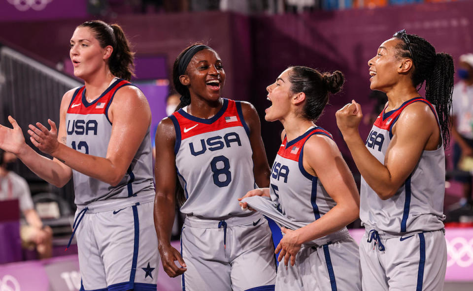 Team USA celebrates winning gold. From left: Stefanie Dolson, Jaqueline Law, Kelsie Plum and Allisha Gray. / Credit: Robert Gauthier/Los Angeles Times via Getty