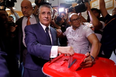 Tunisian presidential candidate Nabil Karoui casts his vote at a polling station during a second round runoff of a presidential election in Tunis