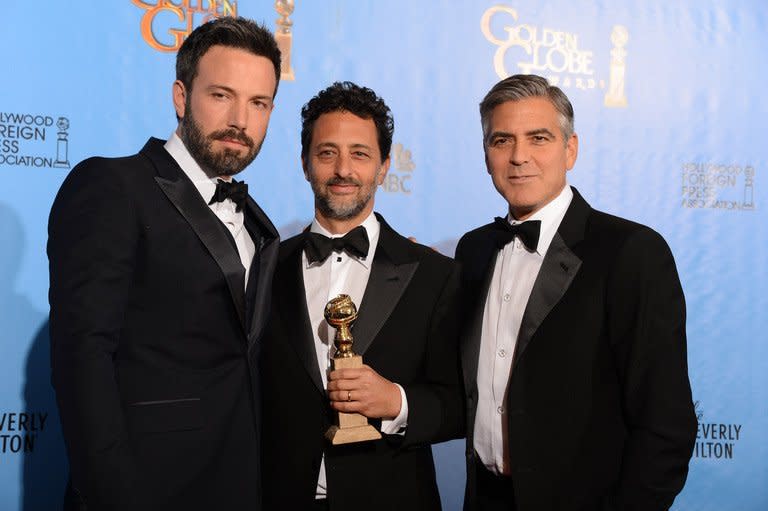 Actor/director Ben Affleck (left) and producers Grant Heslov (centre) and George Clooney with the award for best motion picture drama for "Argo" at the Golden Globes awards ceremony in Beverly Hills on January 13, 2013. Iran is to make its own movie about the American hostage drama during the 1979 Islamic revolution to counter the "distorted" film "Argo."