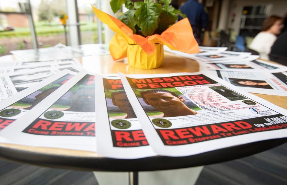 Reward posters for Derrick Henagan are seen at Michigan's Missing Persons Day event held at Madonna University - Franciscan Center, in Livonia.