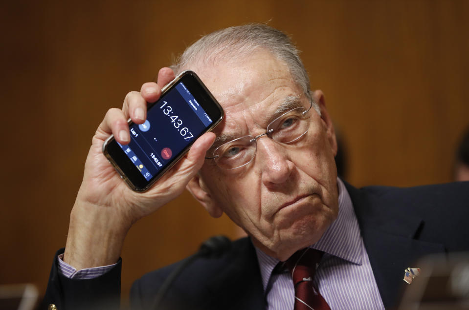 <span class="s1">Chuck Grassley holds up a smartphone timer to show Sen. Cory Booker how long he has been speaking during the Kavanaugh hearings in September. (Photo: Pablo Martinez Monsivais/AP)</span>