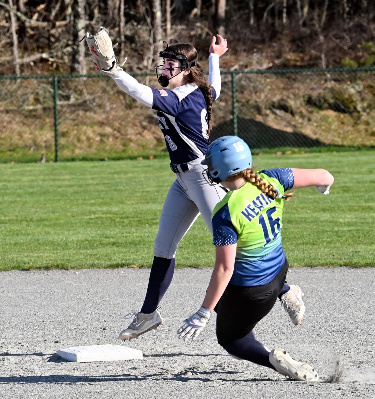 Shannon Keating of Sturgis slides into second breaking up a double play by Lilly Furman of Monomoy.