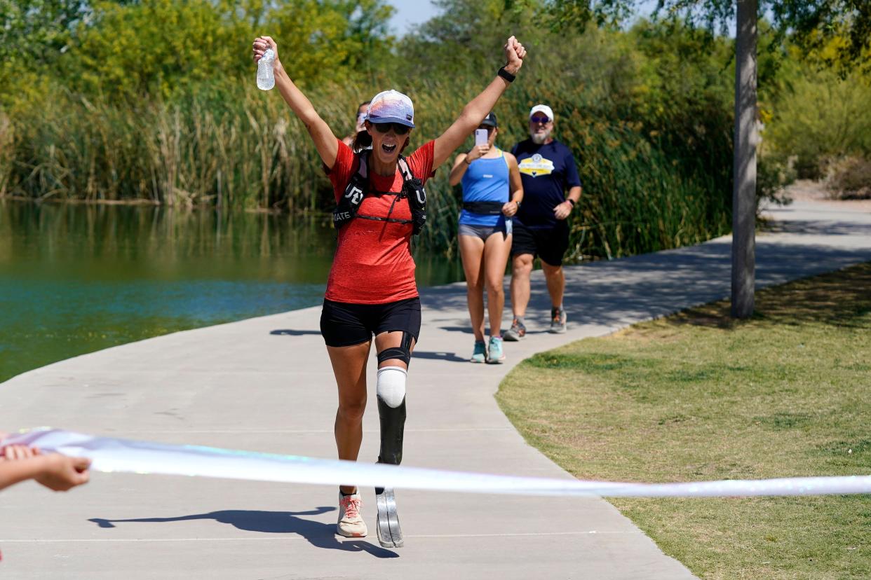 Jacky Hunt-Broersma finishes her 102nd marathon in 102 days, this one at Veterans Oasis Park, Thursday, April 28, 2022, in Chandler, Arizona