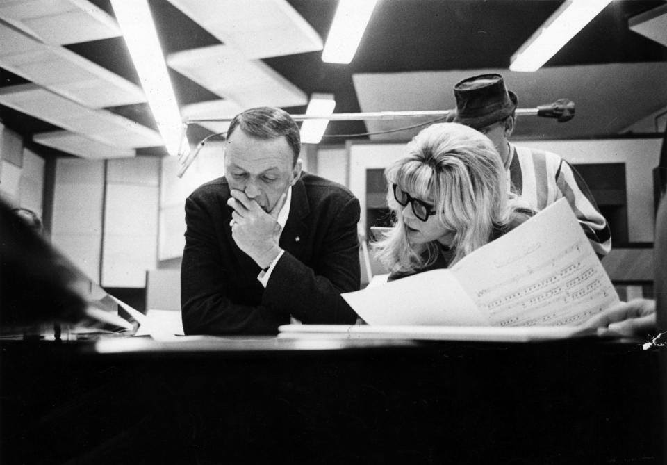 <p>Frank Sinatra discusses a musical interpretation with his daughter Nancy while they work on their first recording together in Hollywood, 1967.</p>